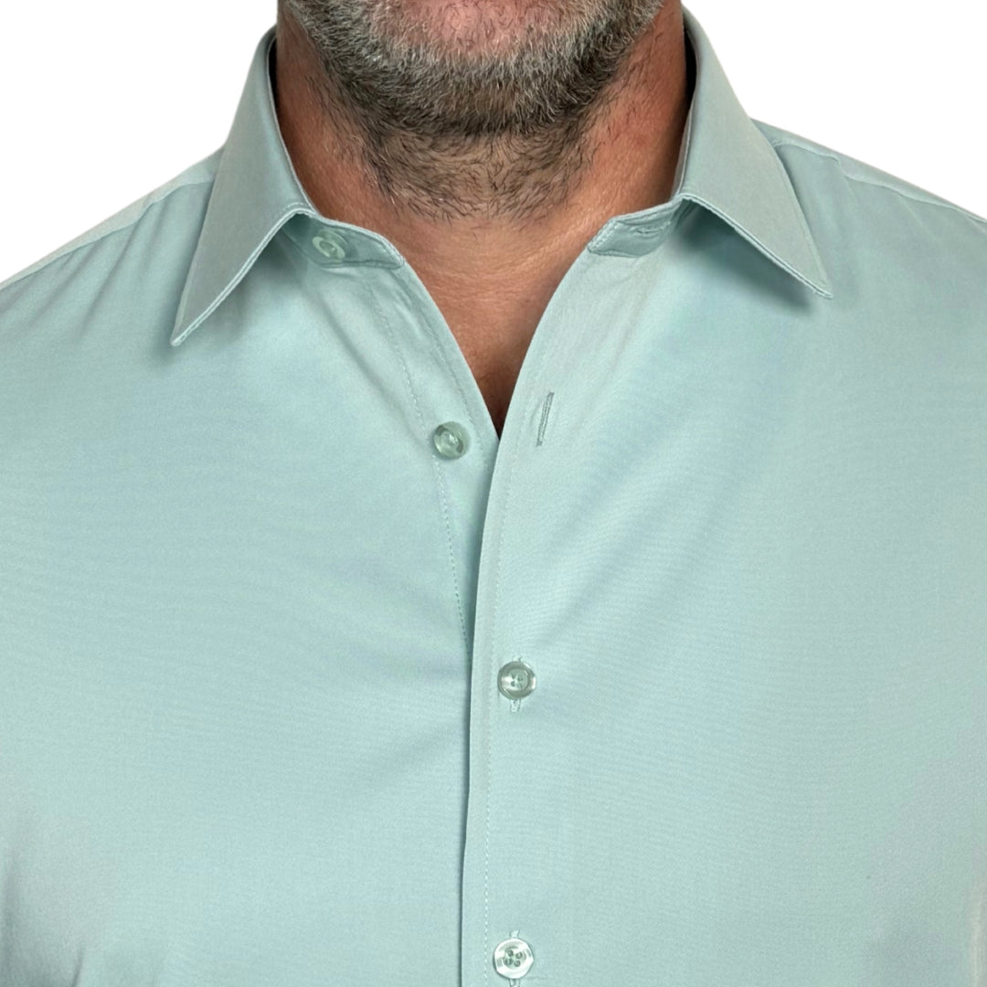 Close-up of collar and wrinkle-resistant fabric on light green goTIELESS shirt, built to perform