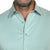Close-up of collar and wrinkle-resistant fabric on light green goTIELESS shirt, built to perform
