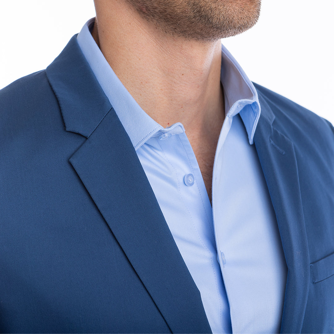 Open collar look in light blue shirt with hidden Million Dollar Collar stays for a structured finish.